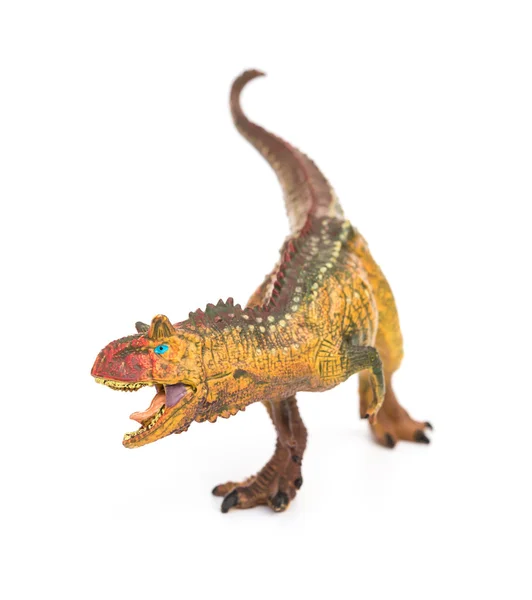 Fehér alapon barna carnotaurus játék — Stock Fotó