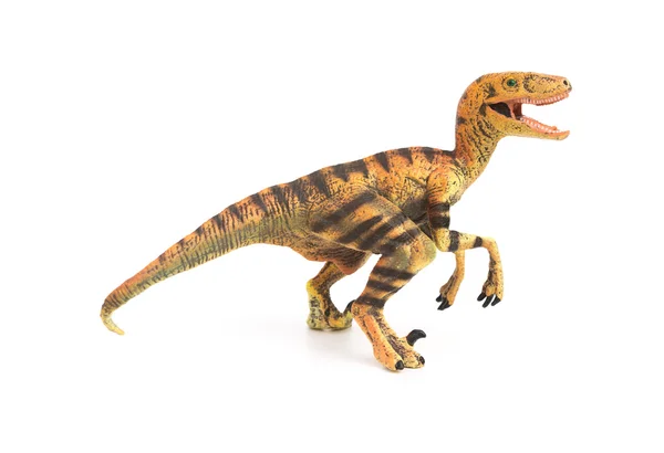 Sidan Visa gul velociraptor leksak på en vit bakgrund — Stockfoto