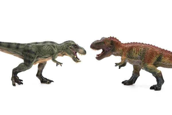 Two tyrannosaurus toys on a white background — Stock Photo, Image