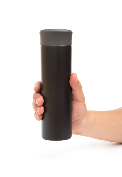Mão segurando um copo de vácuo preto em um fundo branco — Fotografia de Stock