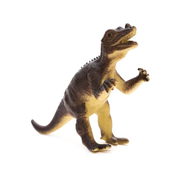 Jouet dinosaure en plastique marron sur fond blanc — Photo