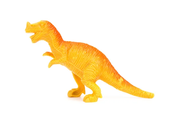 Vue de côté jouet de dinosaure en plastique orange sur fond blanc — Photo
