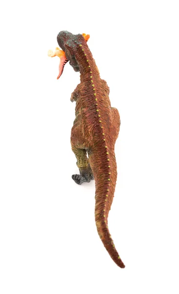 Bovenaanzicht tyrannosaurus speelgoed vangen van een kleinere disonaur op witte achtergrond — Stockfoto