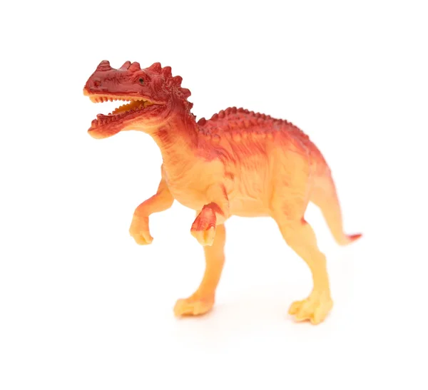 Zabawka dinozaur plastik pomarańczowy na białym tle — Zdjęcie stockowe