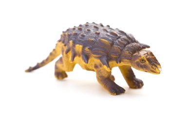 Beyaz bir arka plan üzerinde kahverengi plastik dinozor oyuncak