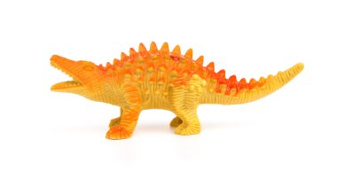yan görünümü turuncu plastik dinozor oyuncak beyaz bir arka plan üzerinde