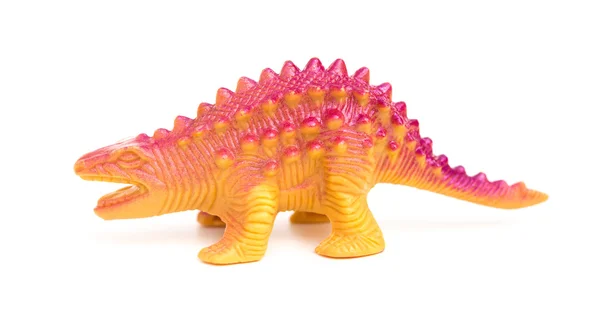 Vue de côté jouet de dinosaure en plastique orange sur fond blanc — Photo