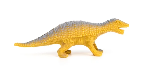 Vue de côté jouet de dinosaure en plastique orange sur fond blanc — Photo