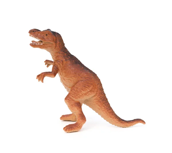 Juguete dinosaurio plástico marrón vista lateral sobre un fondo blanco — Foto de Stock