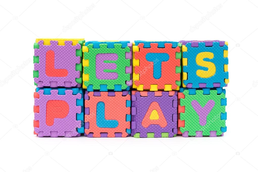 letters of lets play made by alphabet jigsaw puzzle on white