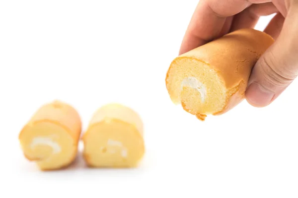 Hand holding a sweet roll with two on background on white — Stock Photo, Image