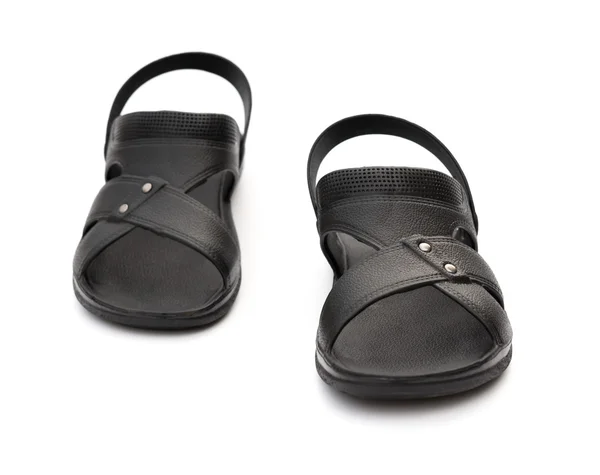 Paar schwarze Freizeit-Sandalen auf weißem Hintergrund — Stockfoto