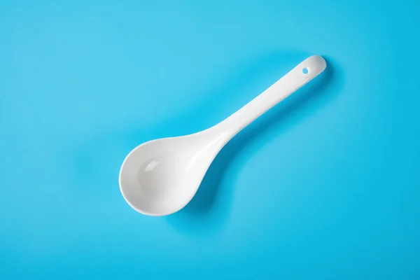 Top View Ceramic Soup Spoon Blue Background — Stock Photo, Image