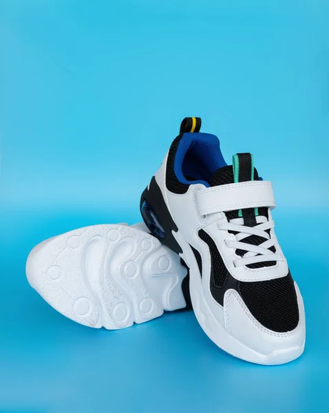 Pair White Black Sporty Shoes Kid Blue Background — Stock Photo, Image