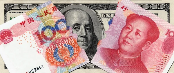 Tearing RMB and USD in the bottom — Stock Photo, Image