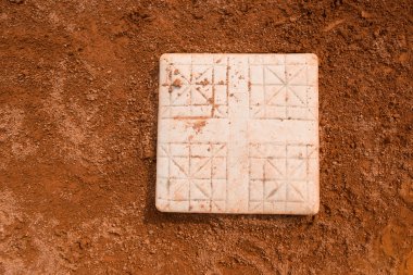 Base in a baseball field close up clipart