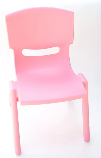 Pink plastic chair for children on white, side view — Stock Photo, Image