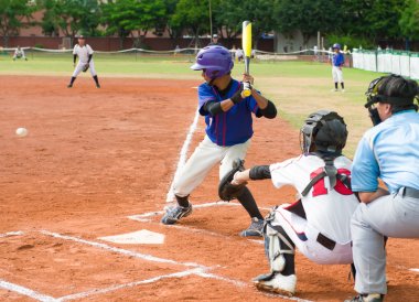 Batter about to hit the ball in a baseball game clipart