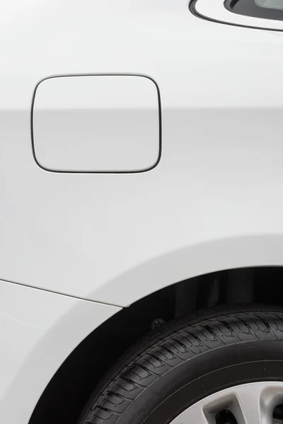 Tyre and petrol cap cover and window of a white car — Stock Photo, Image