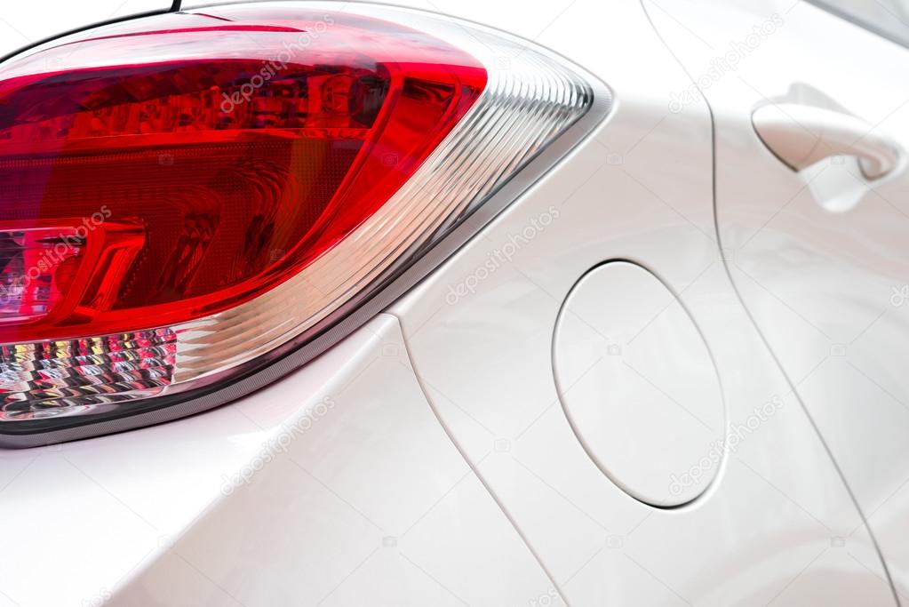 Close up look of a taillight of a white car