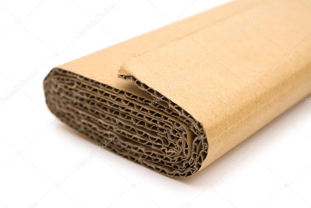 piece of folded cardboard corrugated on a white background