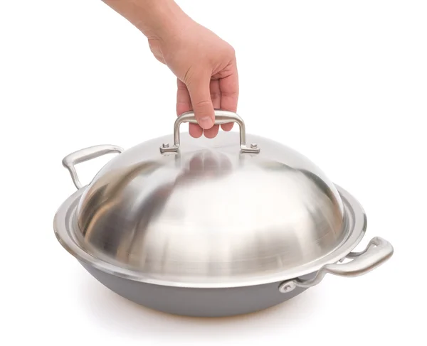 Mão prestes a levantar uma tampa de wok com caminho de recorte — Fotografia de Stock