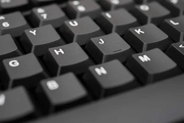 Black keyboard closeup, selective focus — Stock Photo, Image
