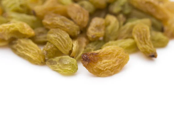 Yellow raisins on a white background with copy space — Stock Photo, Image