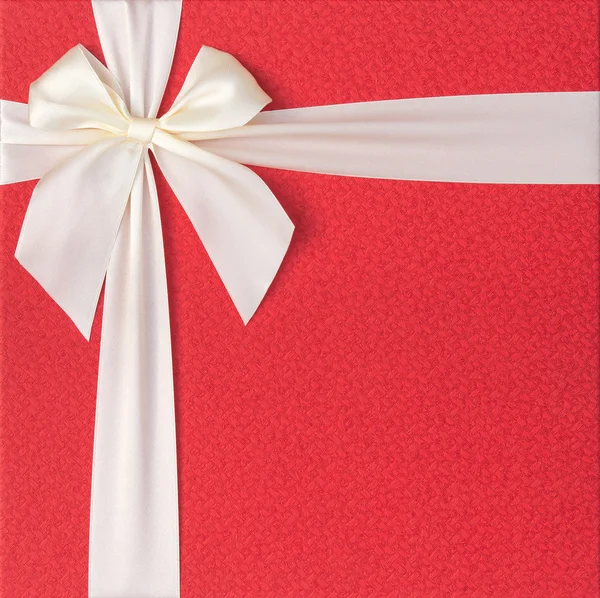 Top view red gift box with beige bow — Stock Photo, Image