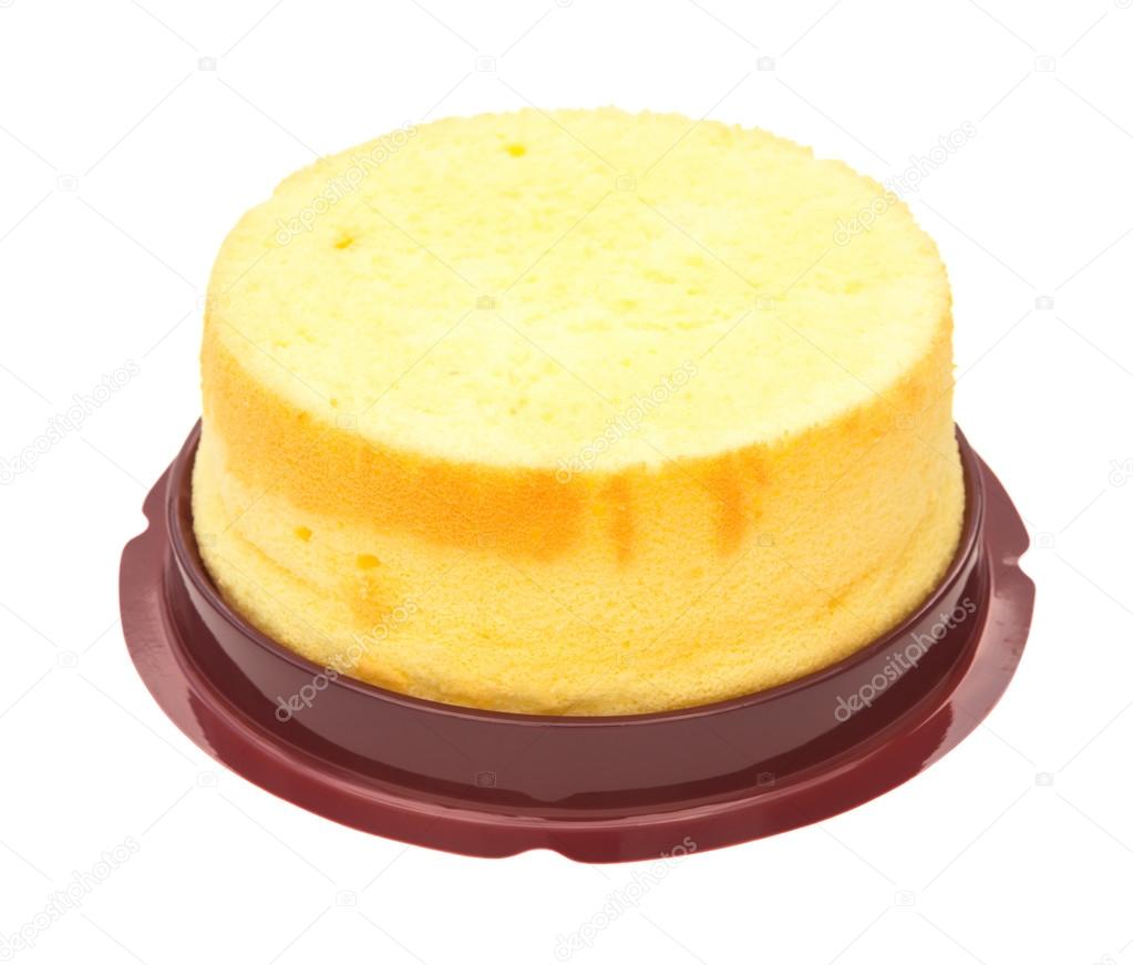 Side view home made round sponge cake on white with clipping path