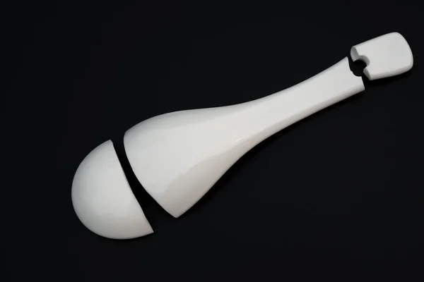 Top view broken porcelain spoon on a black background — Φωτογραφία Αρχείου