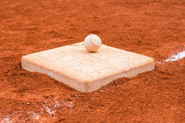Baseball on a base of baseball field — Stockfoto