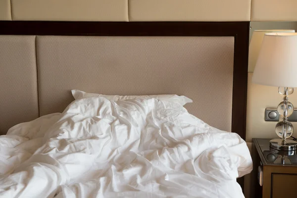 Bed in a hotel room in the morning — Stock Photo, Image
