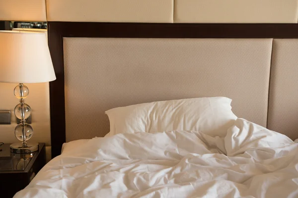 Bed in a hotel room in the morning — Stock Photo, Image