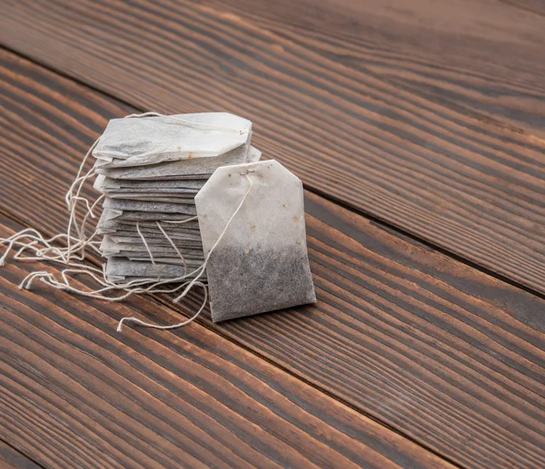 Teabags on a wooden background — Stock Photo, Image