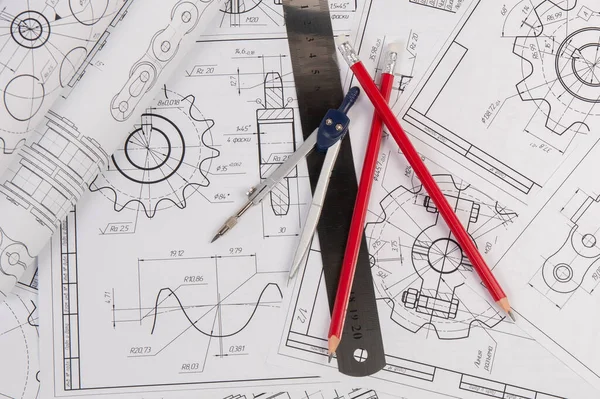 Industrial chain drawings, engineering compass, ruler and pencils