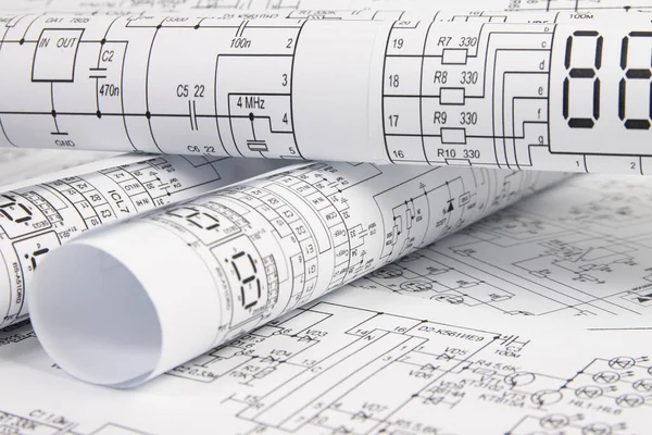 Paper electrical engineering drawings. Work of an electronic engineer.