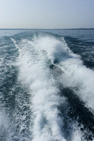 Boat stern waves Royalty Free Stock Photos