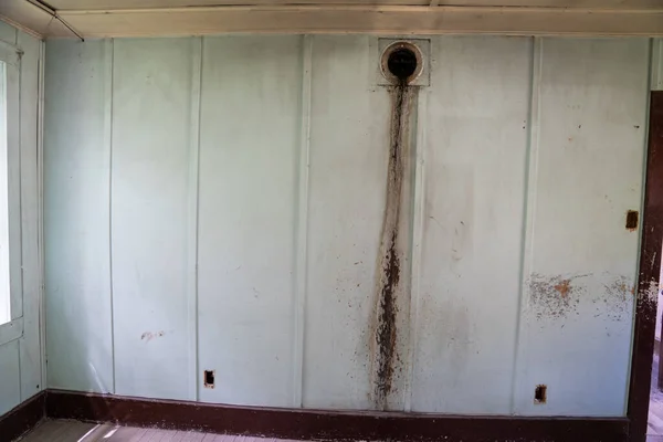 Water damage on a wall in an abandoned building in the Bannack Ghost Town, Montana