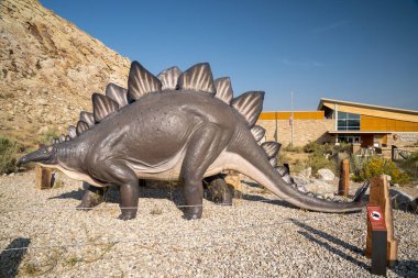 Vernal, Utah - September 20, 2020: The Dinosaur National Monument Visitor Center and gift shop. Plastic Stegosaurus dinosaur displayed clipart