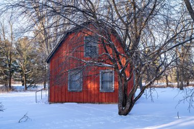 Scandia, Minnesota - January 2, 2021: Exterior of the historic Johannes Erickson Log Home, in winter