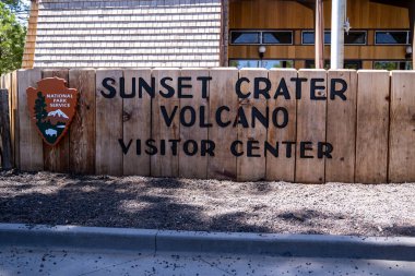 Arizona, USA - May 11, 2021: Sign for the Sunset Crater Volcano Visitor Center in the National Monument clipart