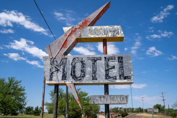 Generic, old abandoned neon sign for a motel along Route 66 in Oklahoma