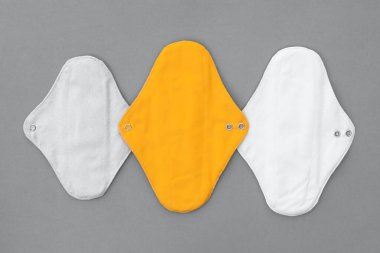 Reusable textile pads for women in trendy color combinations. Trending color combinations of 2021. The trendy colors of 2021 are yellow and gray. clipart