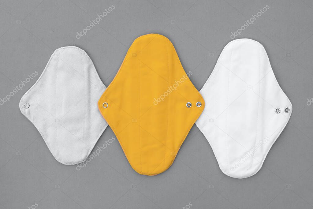 Reusable textile pads for women in trendy color combinations. Trending color combinations of 2021. The trendy colors of 2021 are yellow and gray.