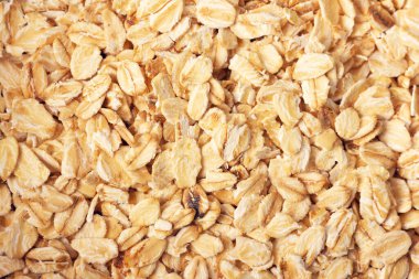 Yuvarlanmış yulaf arka planı. Manzarayı kapat. Düzleştirme biçimi.