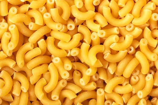 Dry macaroni pasta backround. — Stock Photo, Image