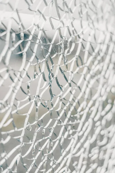 Close-up of broken glass. Abstract background. Selective focus.