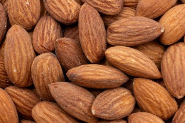 Tuzlu kavrulmuş badem arkaplanı yakın plan