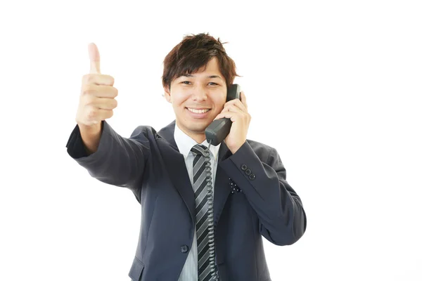 Smiling businessman with thumbs up — Stock Photo, Image